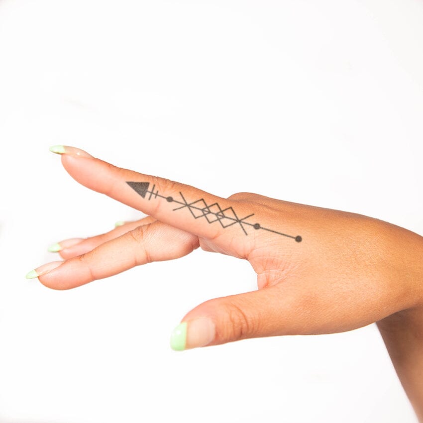 geometric arrow tattoo
