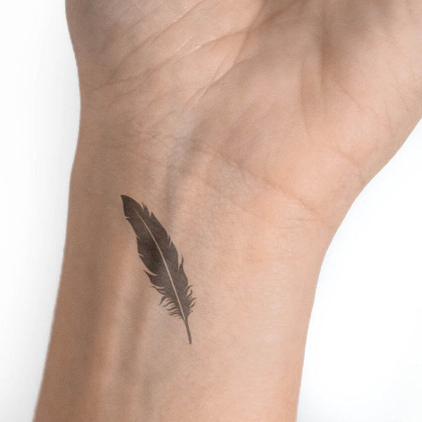 Simple White Ink Feather Tattoo Design Idea